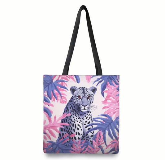 Fierced leopard and tripical leaves tote bag